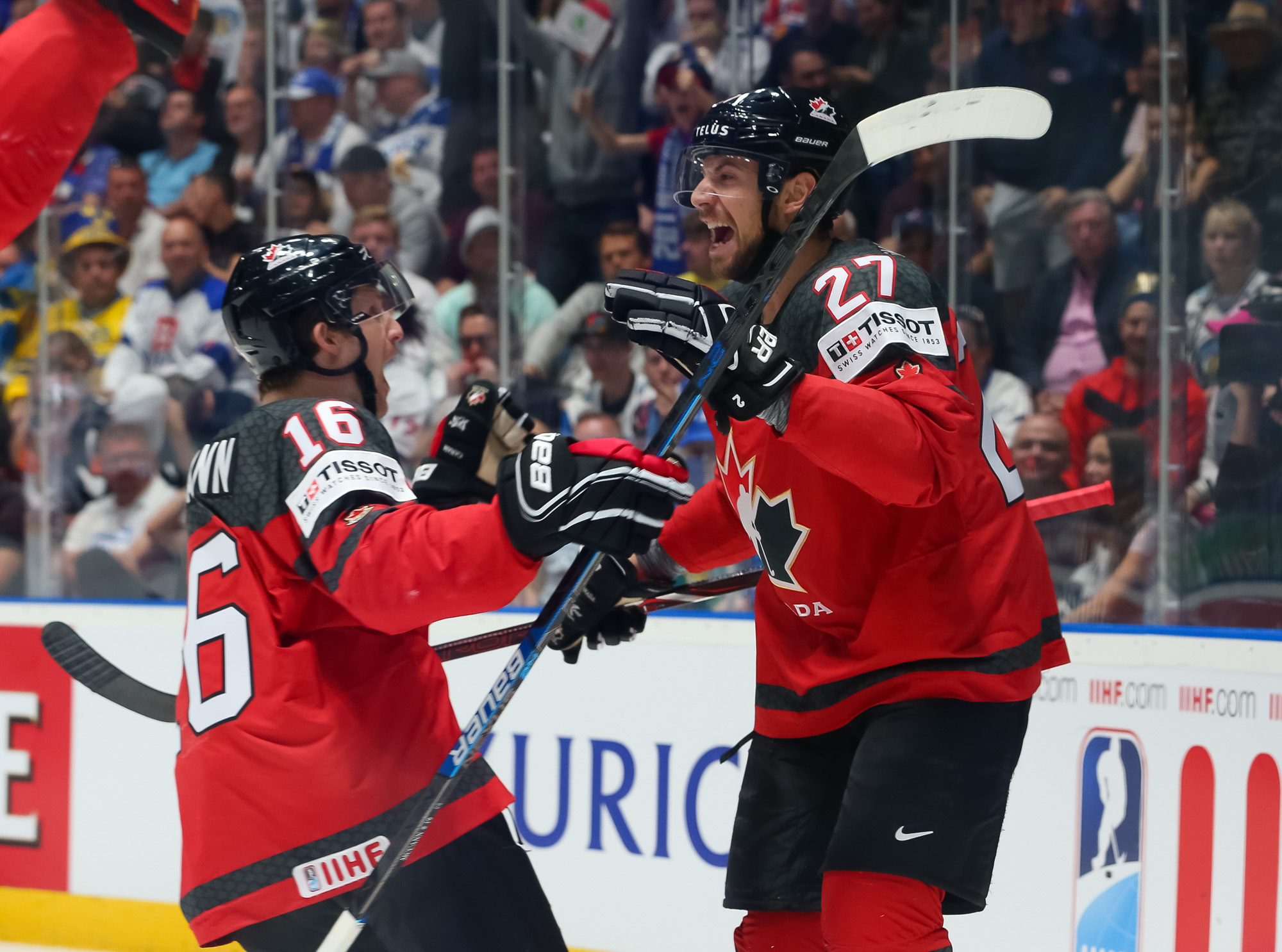 Canada's Shea Theodore (27) celebrates after scoring a goal against Finland  goaltender Kevin Lankinen (30) during the Ice Hockey World Championships  gold medal match at the Ondrej Nepela Arena in Bratislava, Slovakia