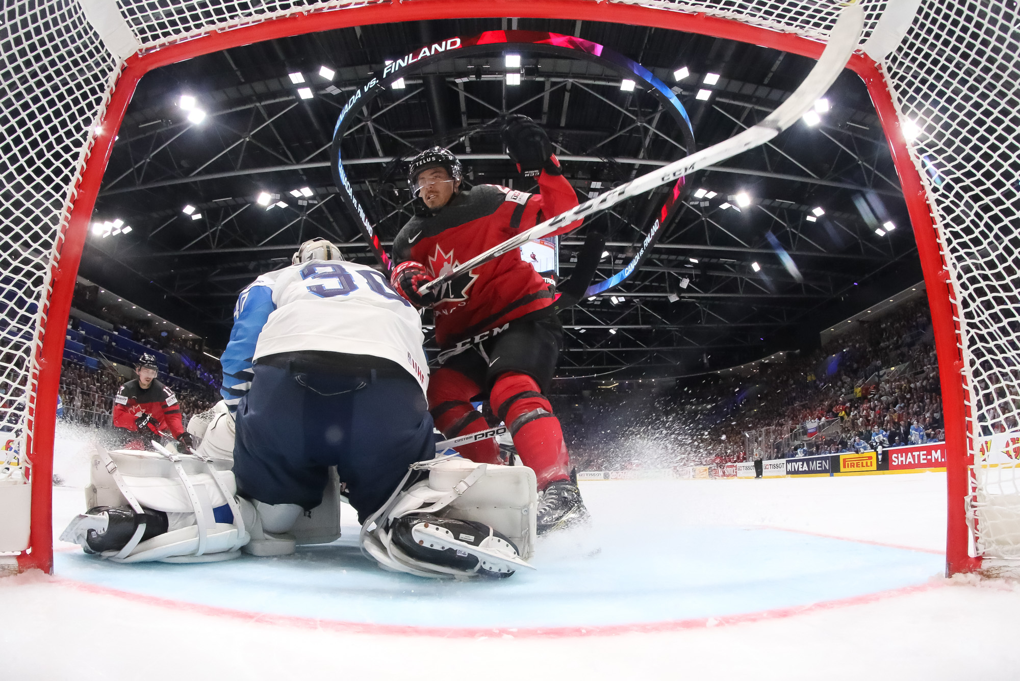 Canada's Shea Theodore (27) celebrates after scoring a goal against Finland  goaltender Kevin Lankinen (30) during the Ice Hockey World Championships  gold medal match at the Ondrej Nepela Arena in Bratislava, Slovakia