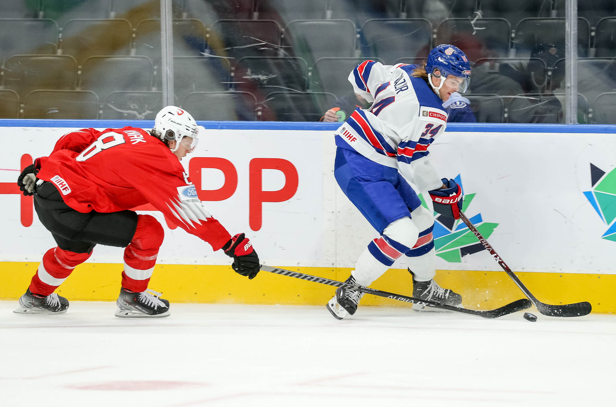 https://blob.iihf.com/iihf-media/iihfmvc/media/2022/wm20aug/games/09-sui-usa/g9usavssui0003ct.jpg