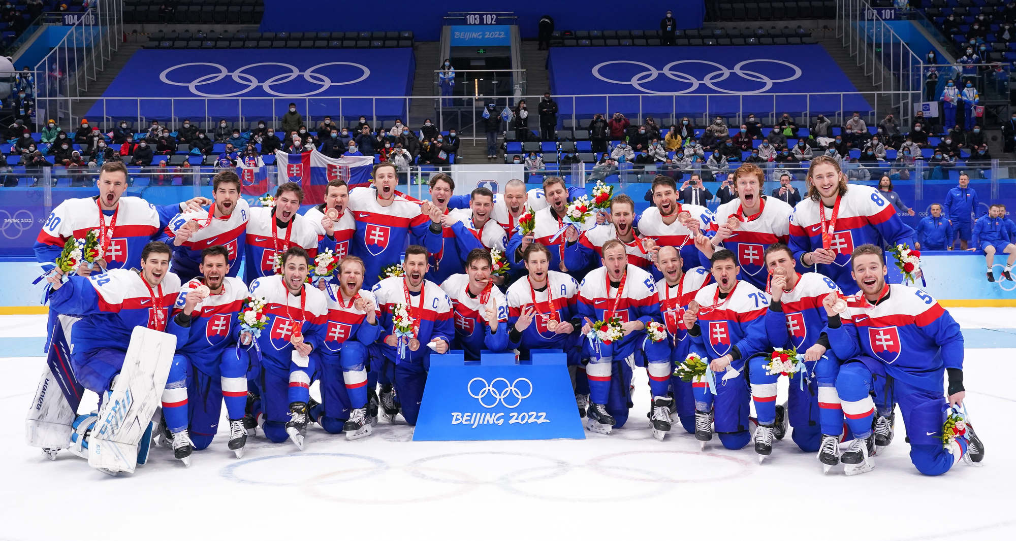 Beijing, China. 19th Feb, 2022. Juraj Slafkovsky (R) of Slovakia celebrates  with his teammates during the ice hockey men's bronze medal game of Beijing  2022 Winter Olympics between Sweden and Slovakia at
