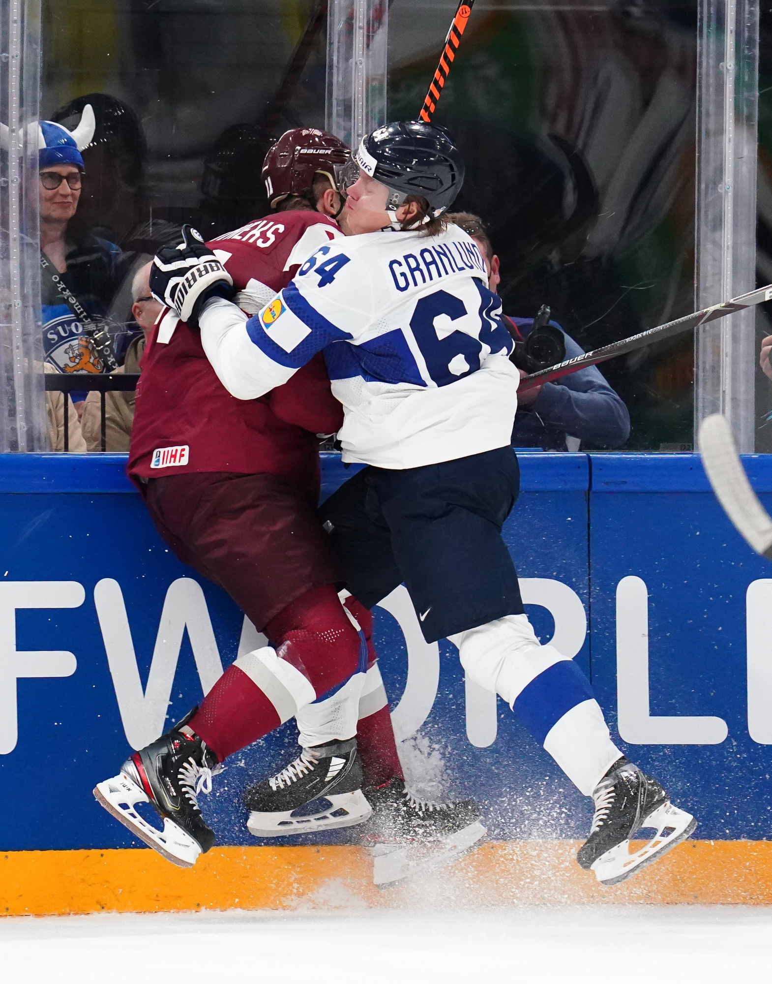 Tampere, Finland. 14th May, 2022. L-R Goalkeeper Elvis Merzlikins (LAT) and  Saku Maenalanen (FIN) in action during the 2022 IIHF Ice Hockey World  Championship, Group B match Latvia vs Finland, on May