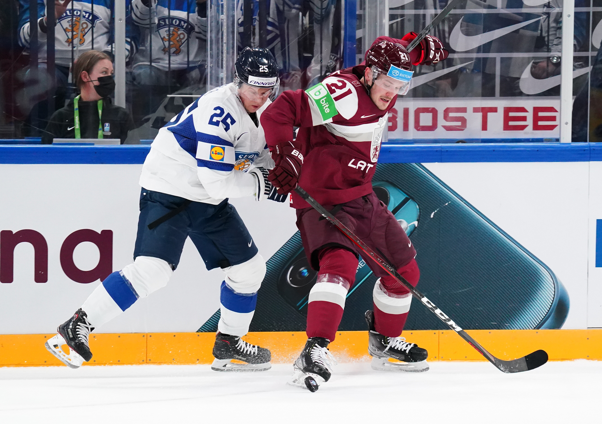 Tampere, Finland. 14th May, 2022. L-R Goalkeeper Elvis Merzlikins (LAT) and  Saku Maenalanen (FIN) in action during the 2022 IIHF Ice Hockey World  Championship, Group B match Latvia vs Finland, on May